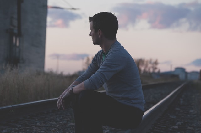 man sitting and thinking